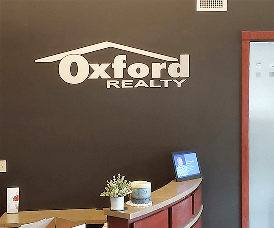 Interior-Logo_Oxford-Realty-Interior-Sign-Faux-Metal