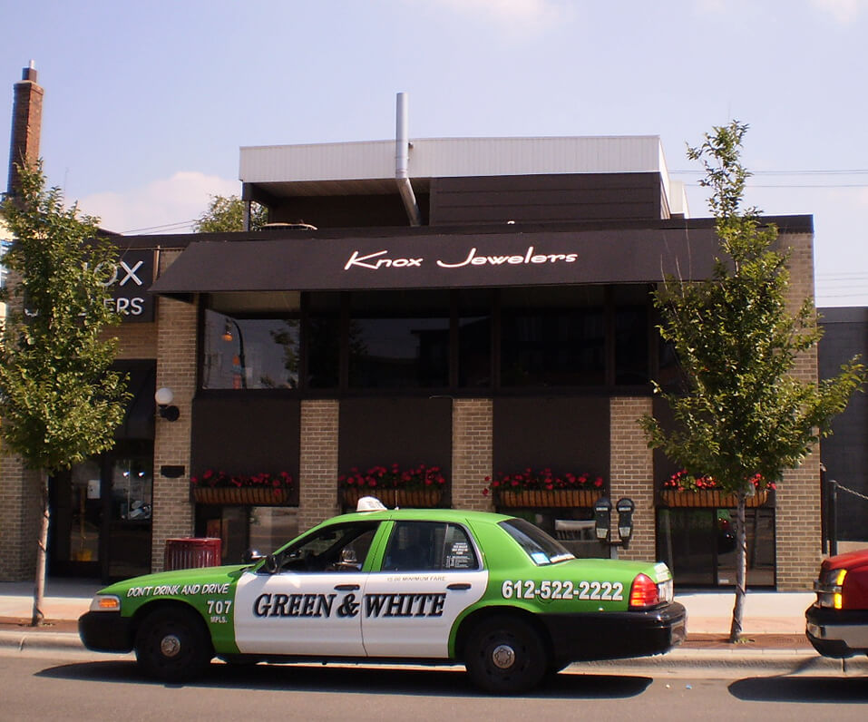 Knox jewelers Awning over building and taxi cab parked in front