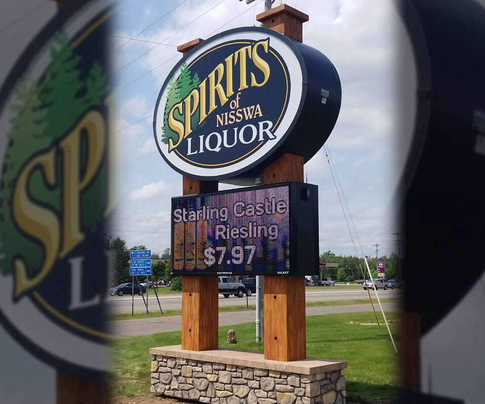 Spirits of Nisswa Liquor Pylon sign with custom covered wood poles brick base and Daktronics EMC Nisswa MN